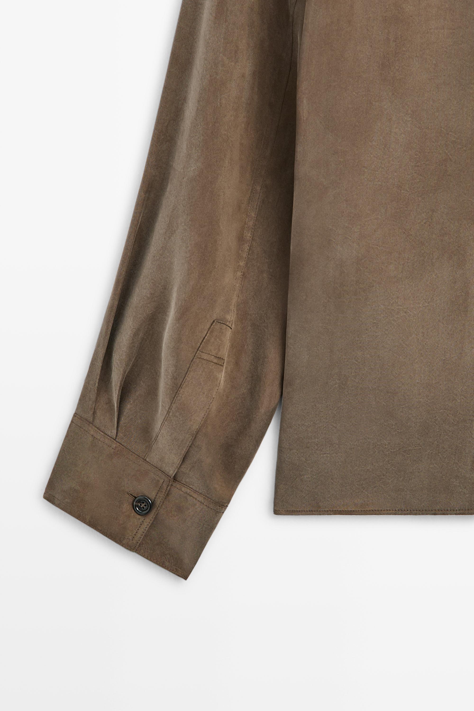 Flowing shirt with stand collar and bib detail